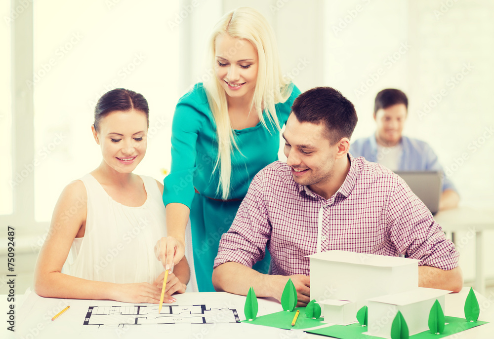 smiling architects working in office