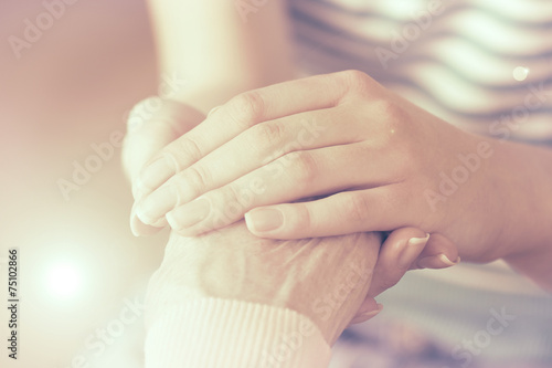 Obraz na plátně Helping hands, care for the elderly concept