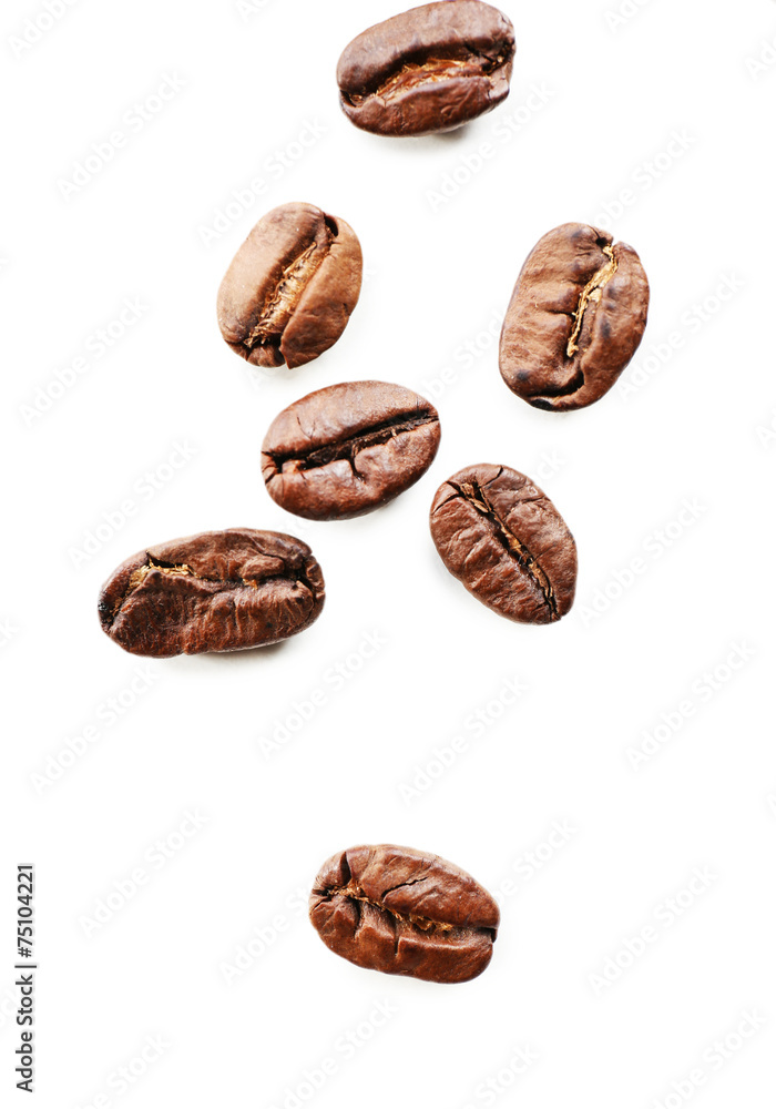 Coffee beans on white table, close-up Coffee beans on white table, close-up