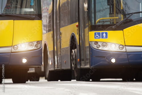 Side by side public transportation - bus.