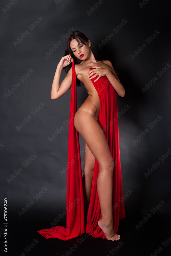 Naklejka premium Nude body covered with a reb fabric