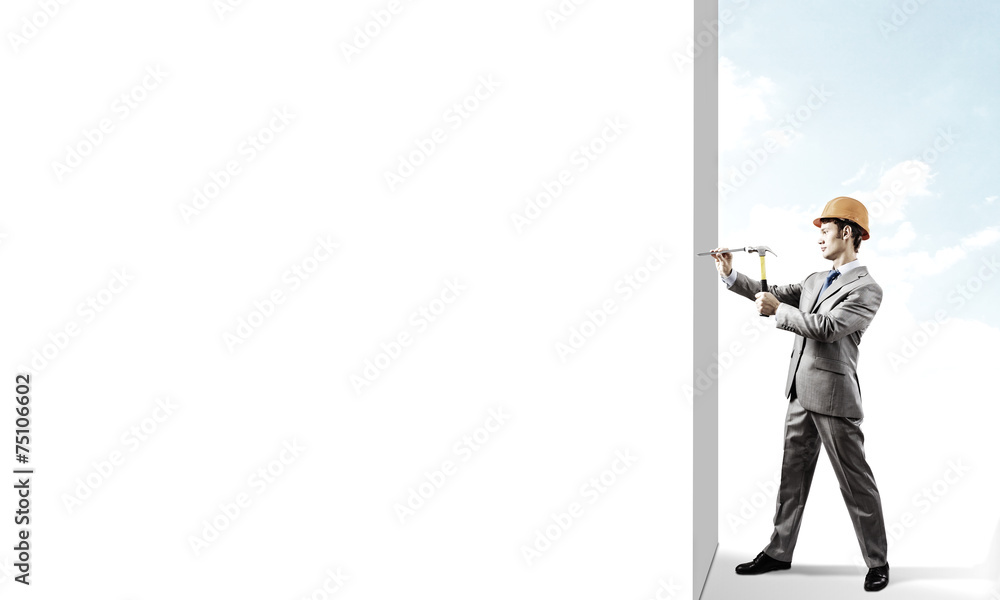 Businessman with hammer