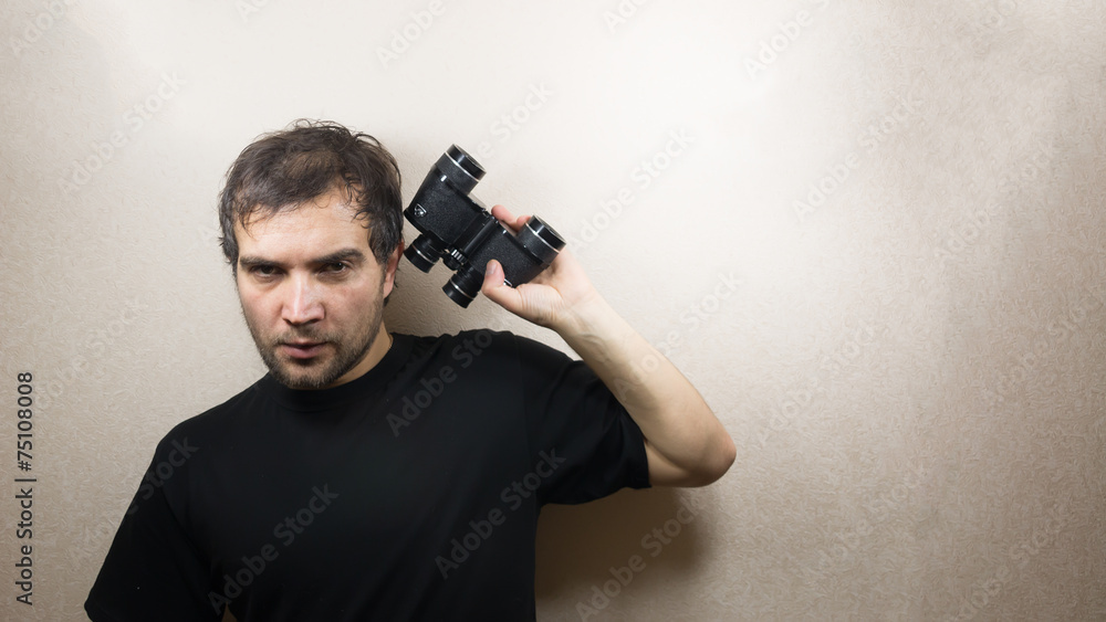 young man with binoculars young man with binoculars