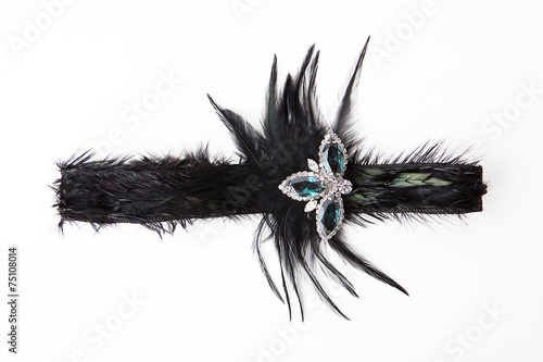 Black feather headband on white