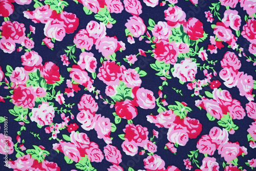 pink rose on dark blue fabric background