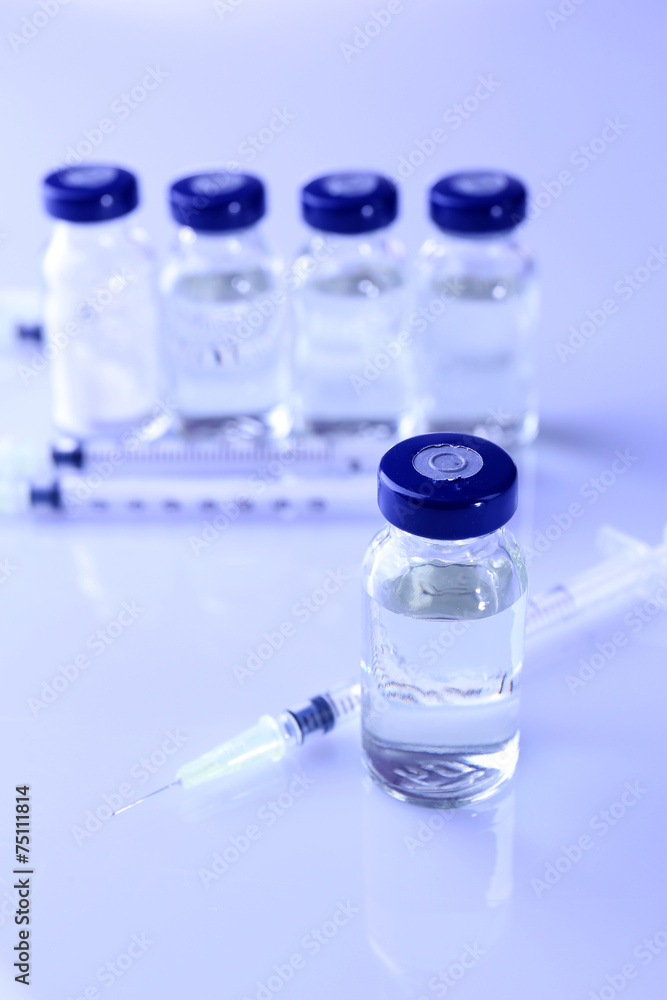 Vaccine in vial with syringe Vaccine in vial with syringe