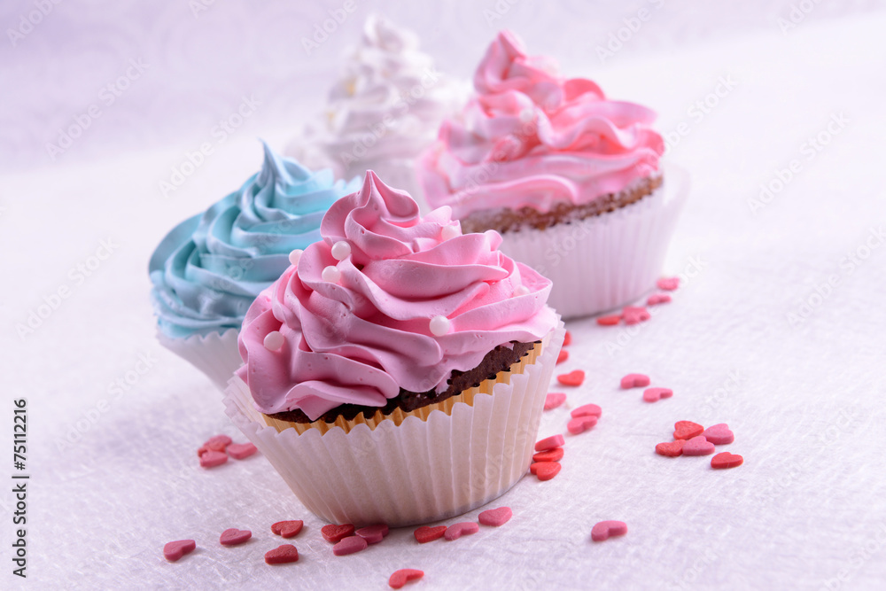 Delicious cupcakes on table close-up Delicious cupcakes on table close-up