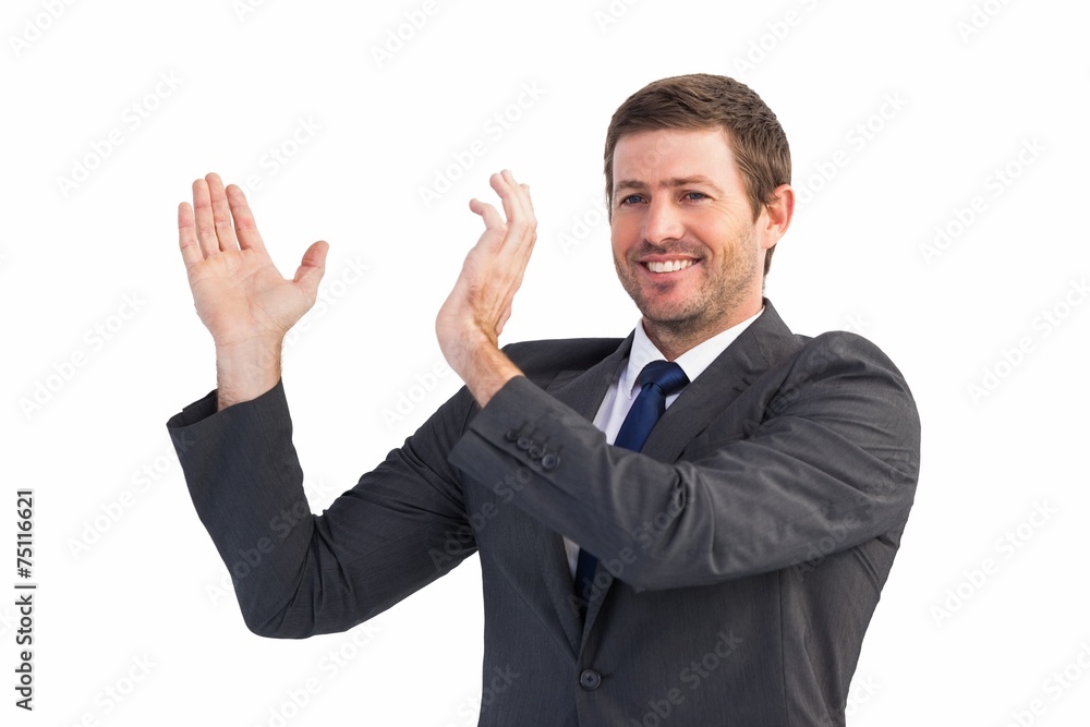Smiling businessman showing something with his hands Smiling businessman showing something with his hands