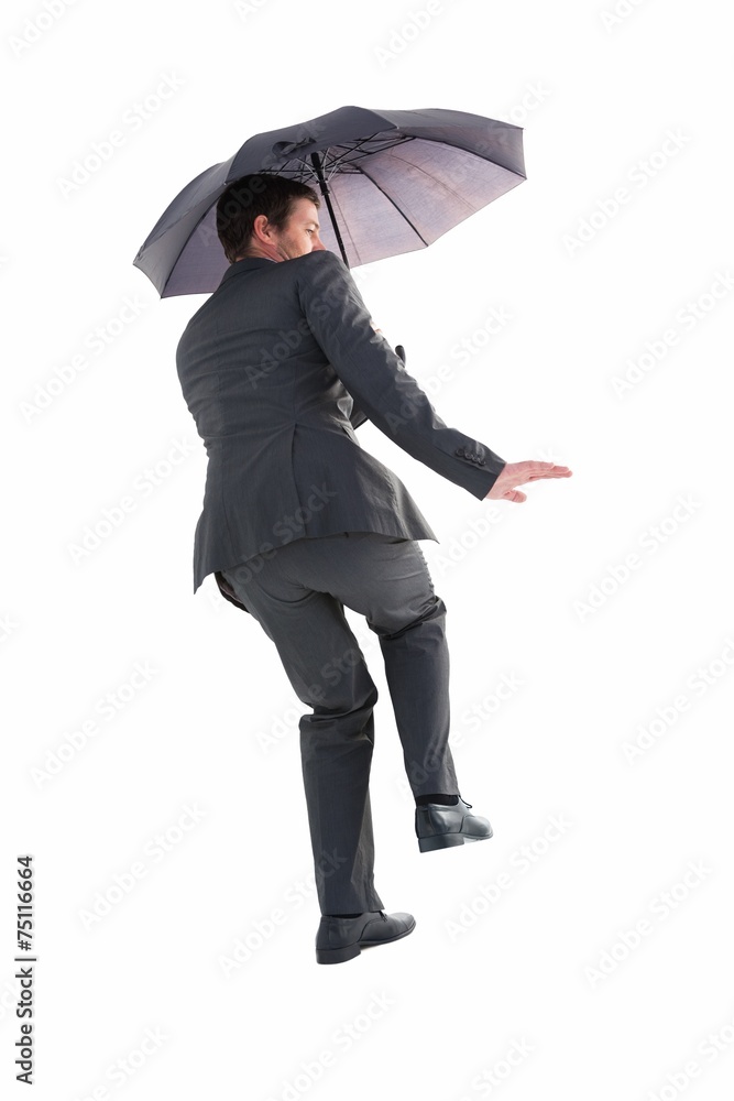Businesswoman in suit holding umbrella Businesswoman in suit holding umbrella