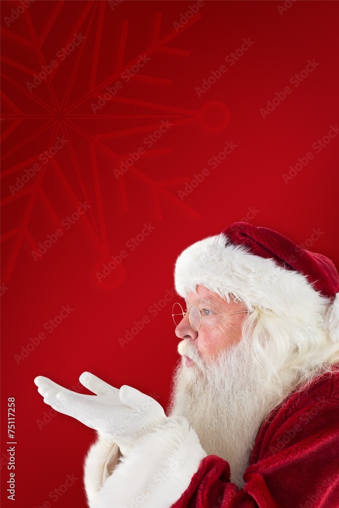 Composite image of santa claus blows something away Composite image of santa claus blows something away