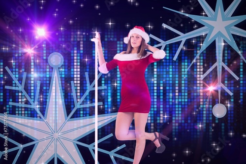 Composite image of pretty santa girl posing with hand