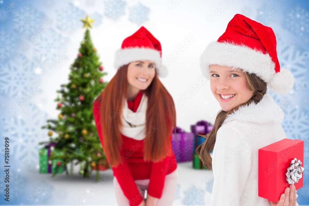 Composite image of mother and daughter with gift Composite image of mother and daughter with gift