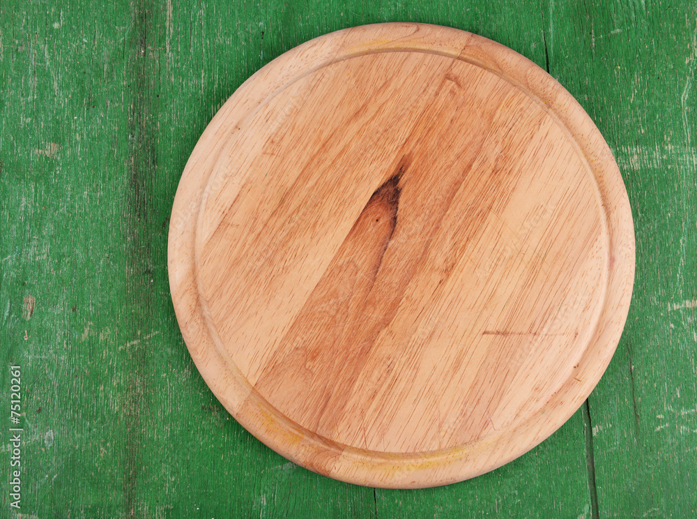 Empty cutting board on wooden background Empty cutting board on wooden background
