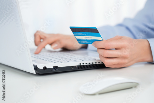 Close up of female hands making online payment
