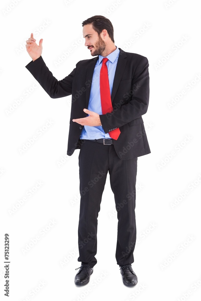 Smiling businessman holding something with his hands Smiling businessman holding something with his hands