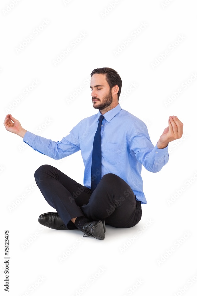 Businessman in suit sitting in lotus pose Businessman in suit sitting in lotus pose