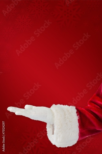 Composite image of santa claus presenting with hand