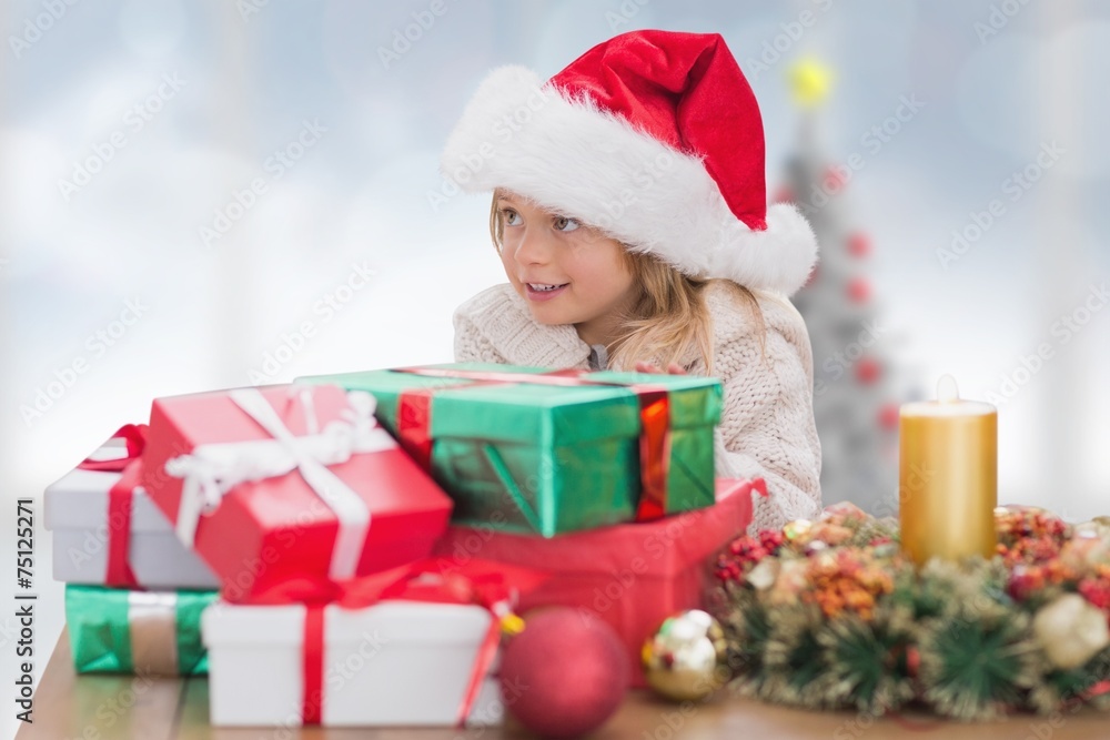 Composite image of cute little girl with gifts Composite image of cute little girl with gifts