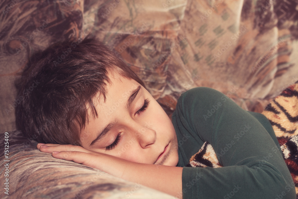 Sleeping child. Toned image. Sleeping child. Toned image.