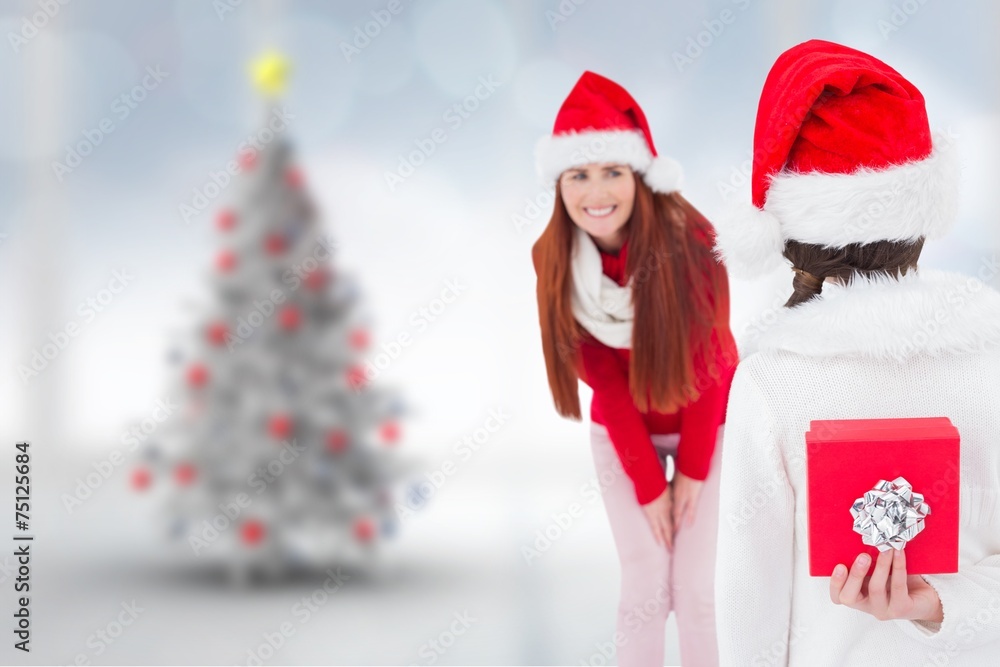 Composite image of mother and daughter with gift Composite image of mother and daughter with gift