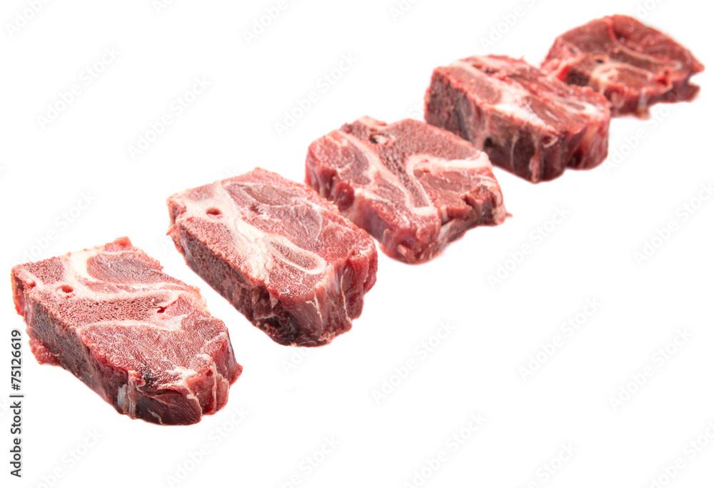 Chunk of cut frozen beef meat over white background Chunk of cut frozen beef meat over white background