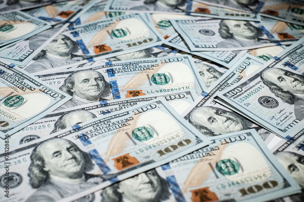 One hundred dollars pile as background One hundred dollars pile as background