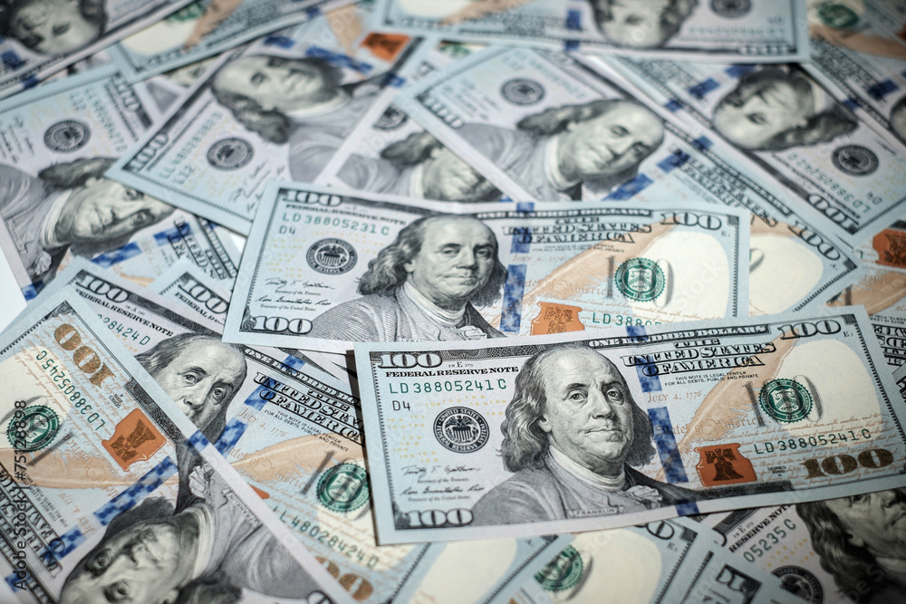 One hundred dollars pile as background One hundred dollars pile as background