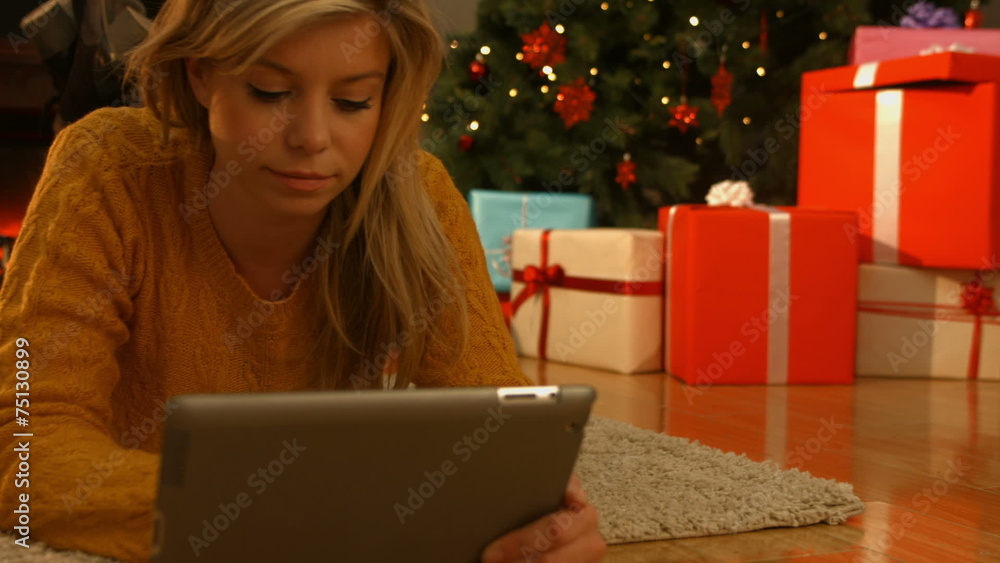 Pretty blonde using her tablet pc Pretty blonde using her tablet pc