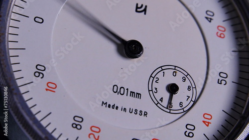 Rotating arrows on the instrument measuring the thickness photo