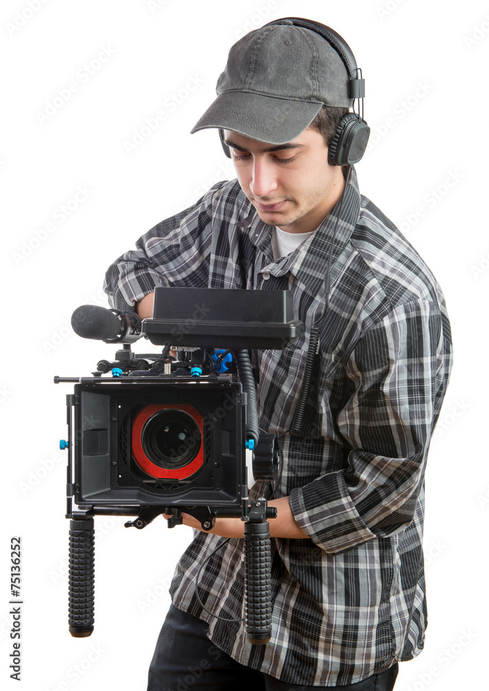 Obraz premium young cameraman with professional camera