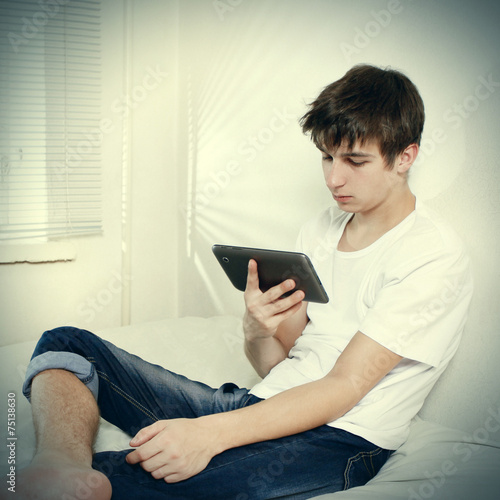 Tired Teenager with Tablet