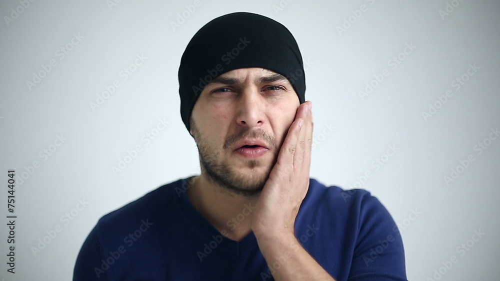 Portrait of a man experiencing toothache. Close up Portrait of a man experiencing toothache. Close up