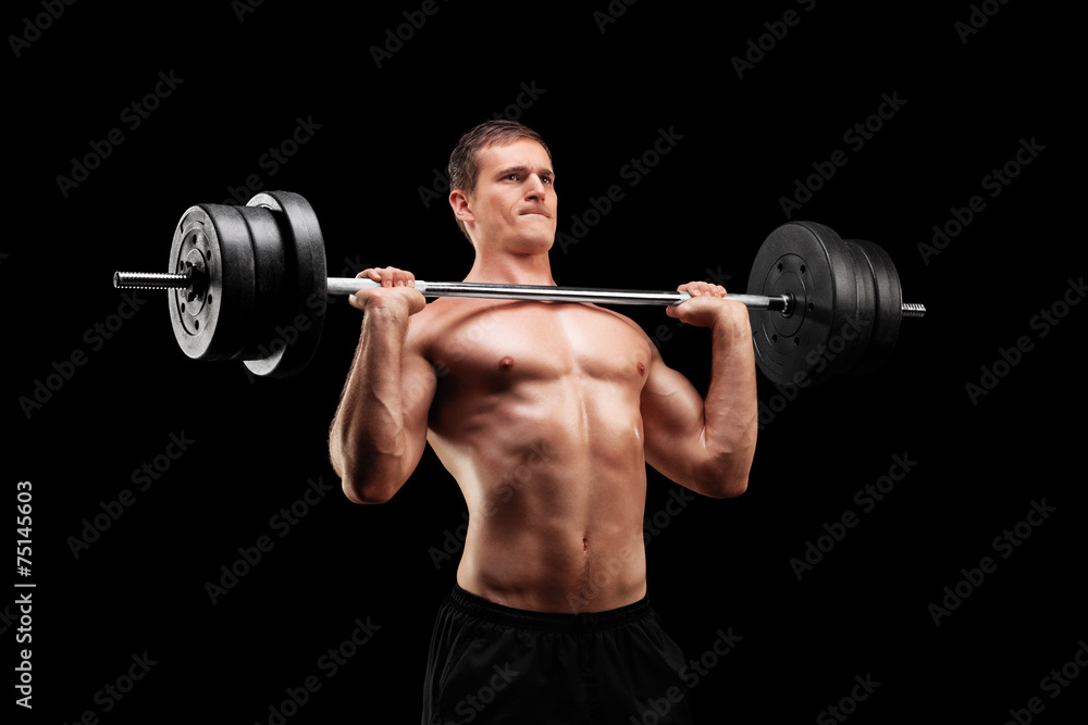 Determined athlete lifting a heavy weight