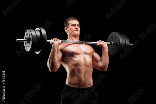 Determined athlete lifting a heavy weight
