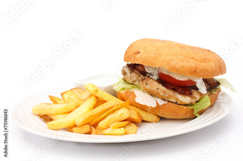 Grilled chicken burger with chips. White background.