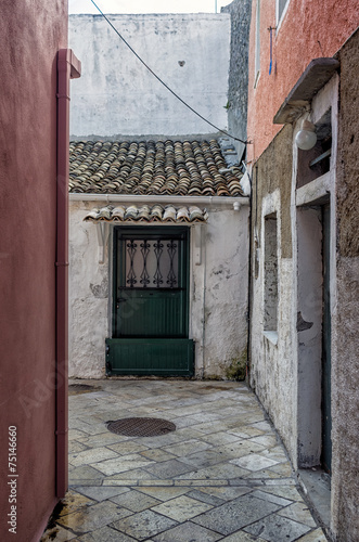Street and buildings in Paxoi island, Greece © kokixx