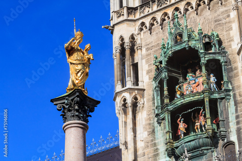Statue of mother Mary on Munich's Marienplatz opposite a detail