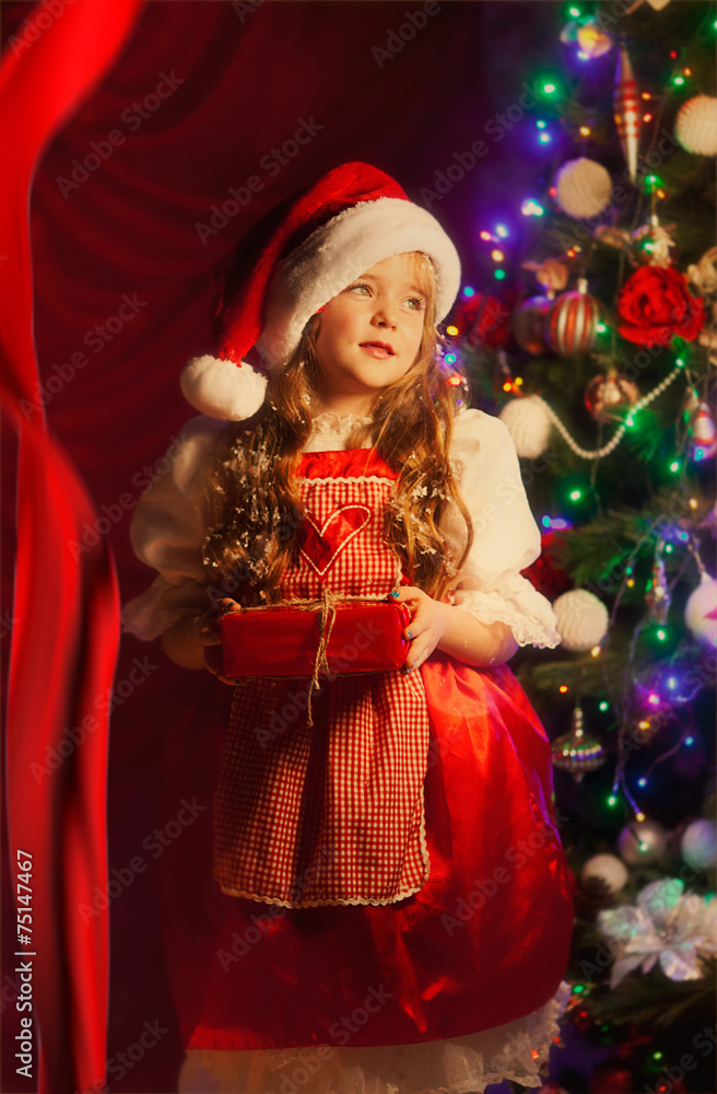 child with gifts for Christmas
