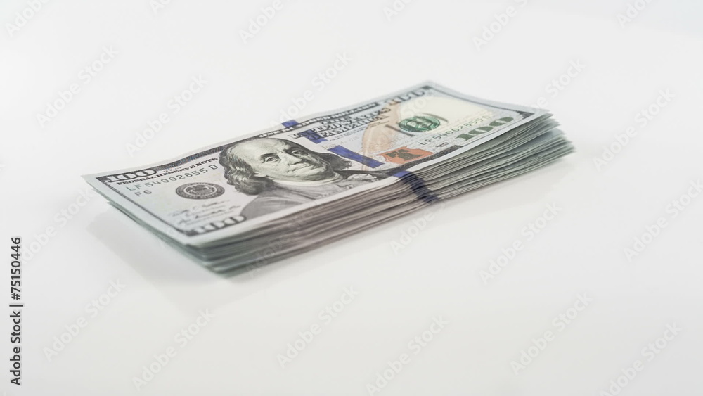 Stack of new 100 US dollar 2013 edition banknotes rotating bills Stack of new 100 US dollar 2013 edition banknotes rotating bills