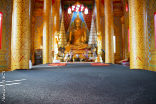 Golden Buddha statue in temple © devilkae