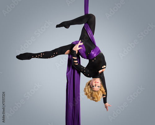 Beautiful dancer on aerial silk, aerial contortion