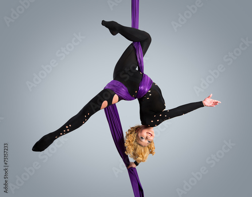 Beautiful dancer on aerial silk, aerial contortion