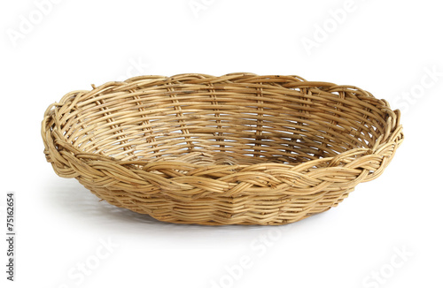 Wicker basket isolated on white background photo