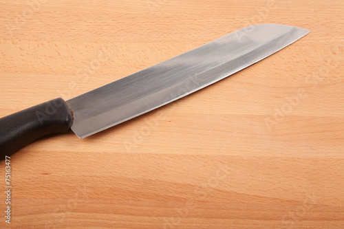 Knife and  wooden chopping board