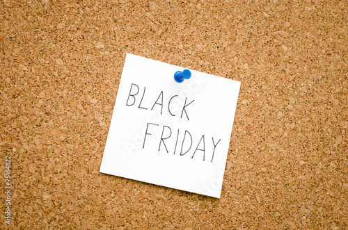 Black friday note reminder pinned to a pinboard