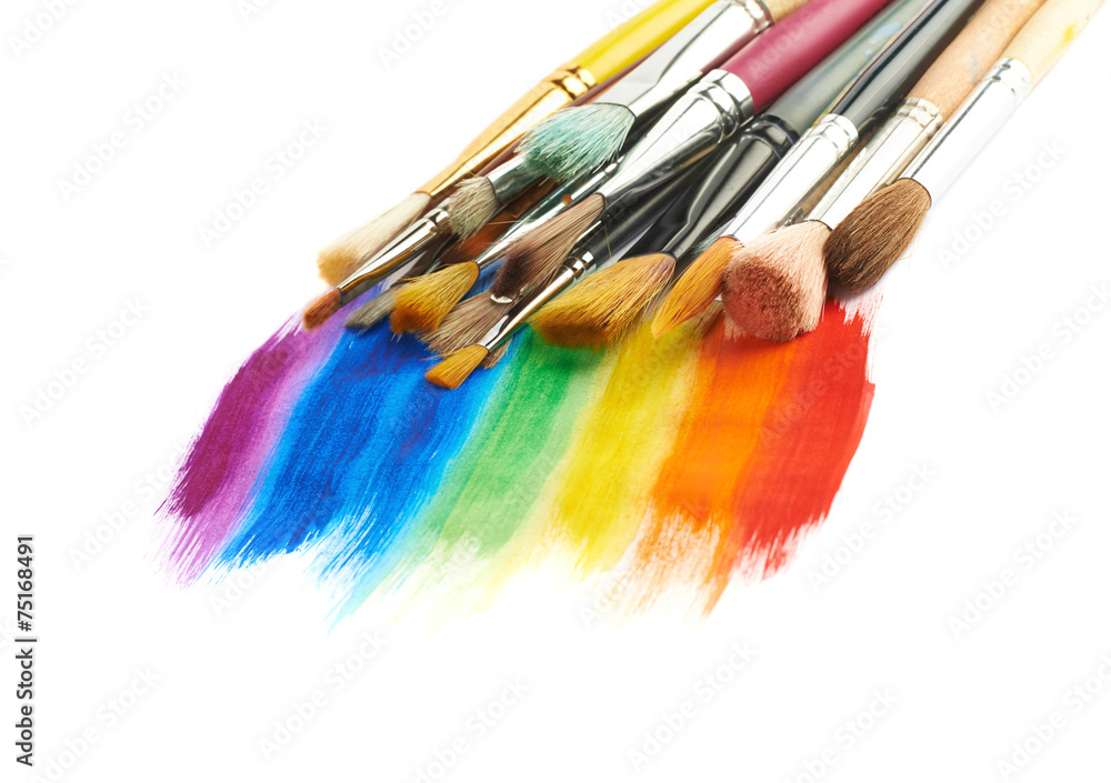 Obraz premium Pile of different brushes over the paint strokes