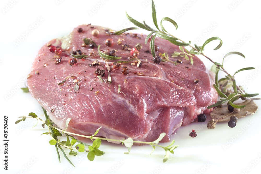 Fresh meat with pepper, mint, rosemary, thyme and spices Fresh meat with pepper, mint, rosemary, thyme and spices