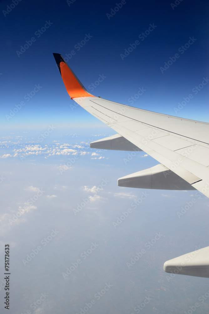 Wing of the plane on sky background Wing of the plane on sky background