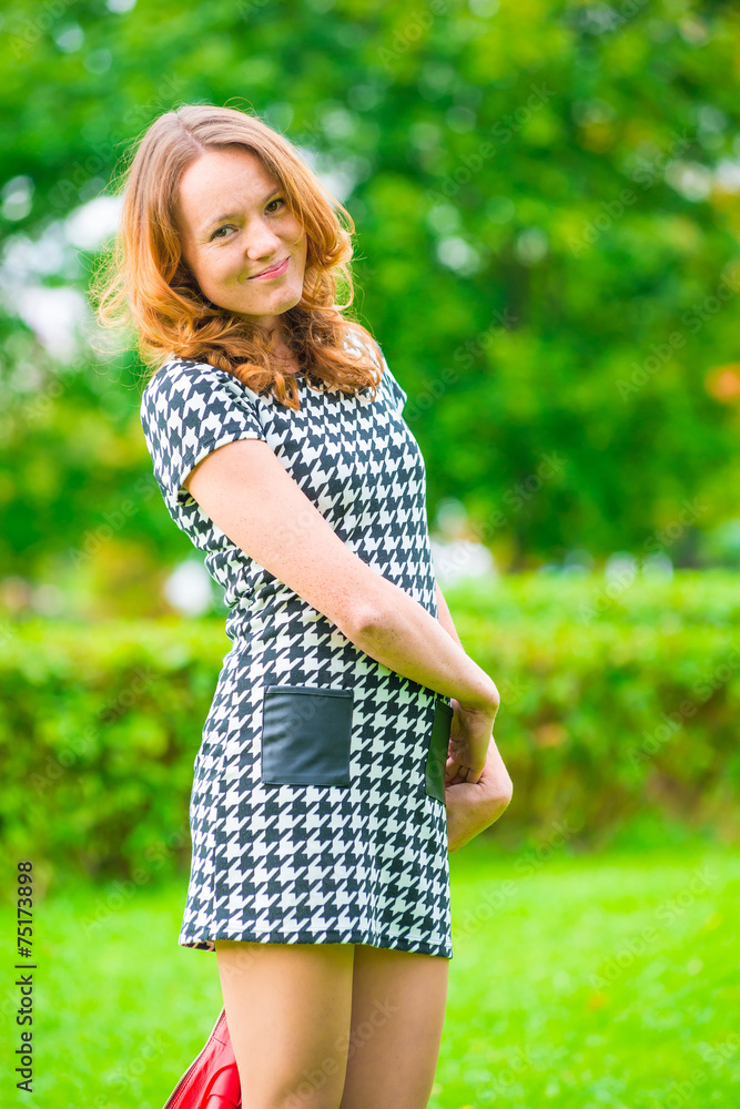 Fototapeta premium portrait of a shy girl with red hair