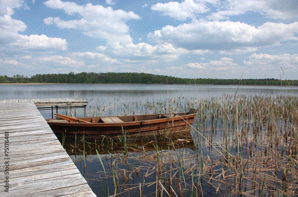 Obraz premium Boats moored on the lake Grutas. Lithuania